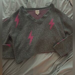 a croped sweater perfect for fall with pink detailing